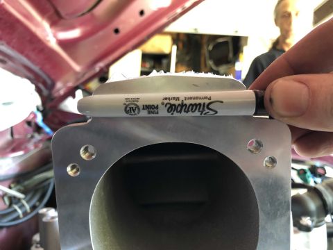 1992 Ford Crown Victoria - A Sharpie marker is used to measure the diameter of a vehicle's throttle body opening.