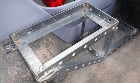 1992 Ford Bronco - Wheel well mount added. The c-channel (shaved down on one side) extends under the platform, and is welded on all sides, so the weight press…