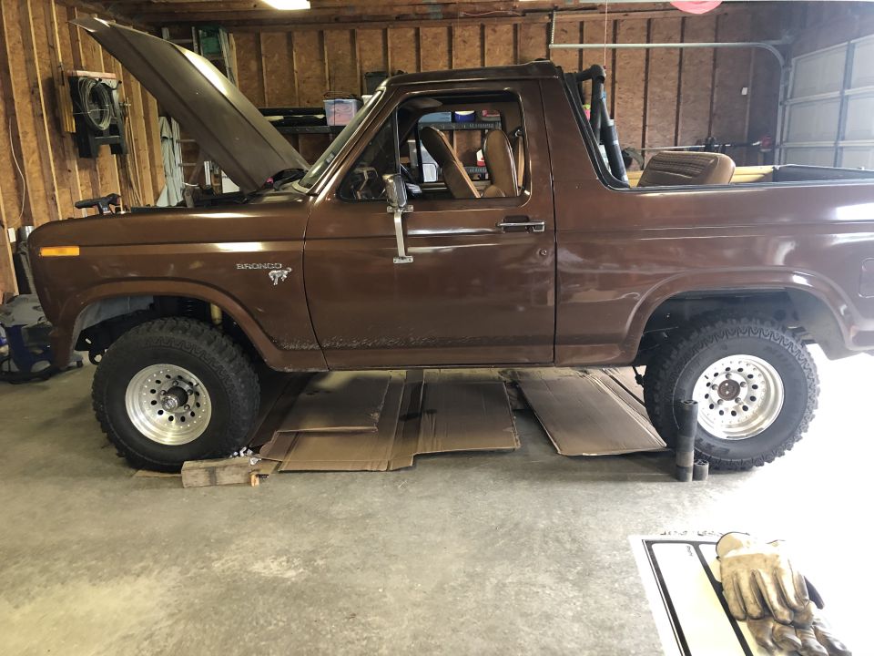 Brown 1980 Ford Bronco side view with hood open