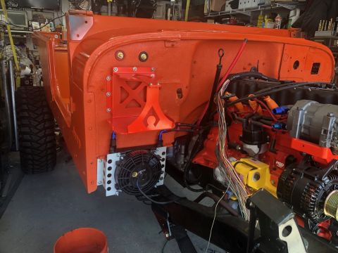 1992 Jeep Wrangler - Vehicle chassis undergoing reassembly with engine components and cooling system visible.
