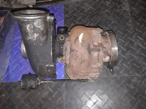 1994 Ford Bronco - Turbocharger assembly shown from the side, with intake and exhaust sides visible.