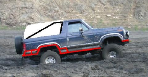 1985 Ford Bronco - This 1985 Ford Bronco is navigating a muddy off-road course.