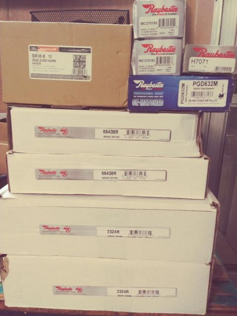 1996 Ford Bronco - Boxes of Raybestos brake rotors and drums are neatly stacked, suggesting parts for vehicle maintenance or repair.