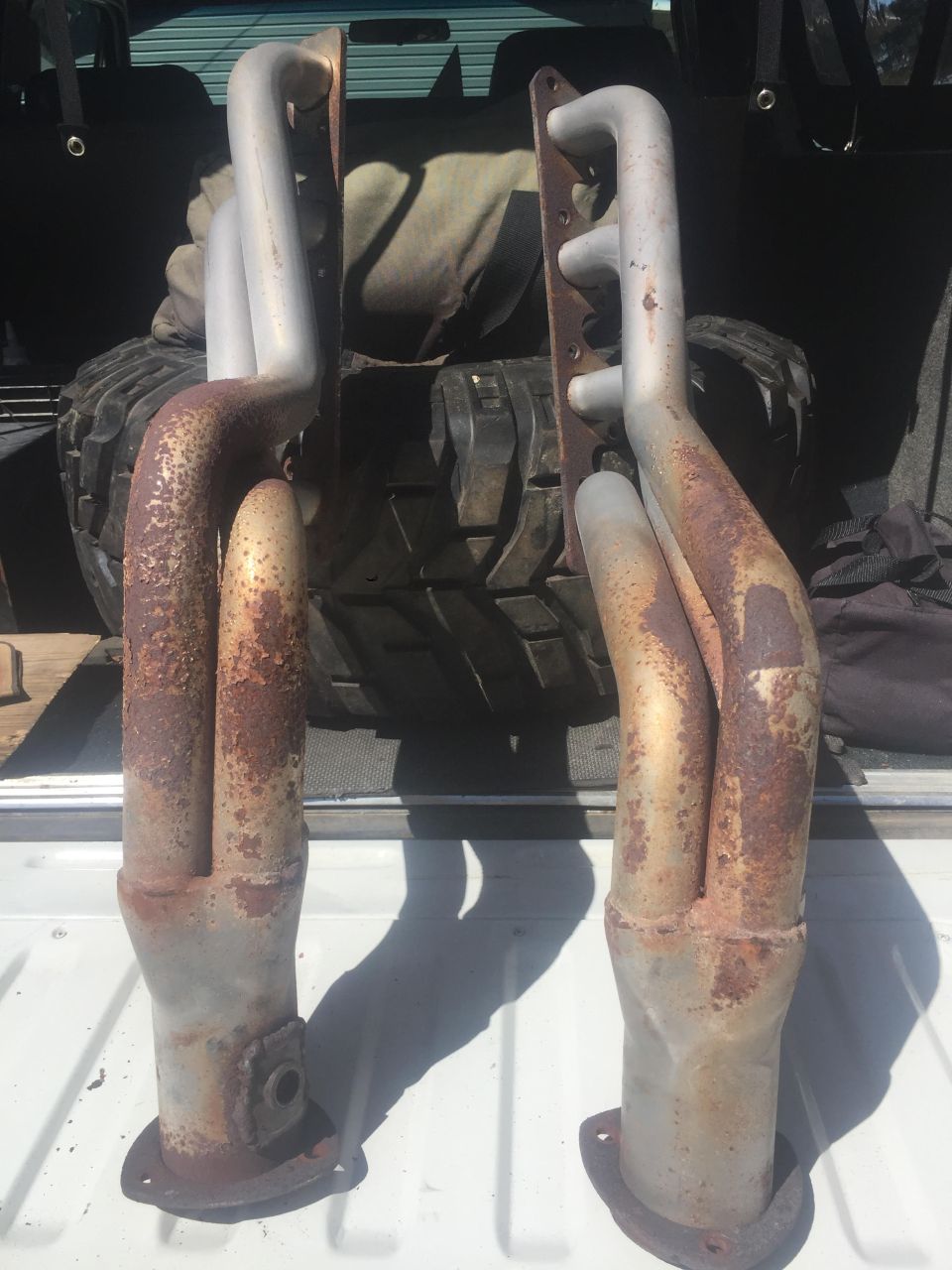 pair of rusty exhaust headers