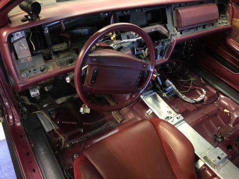 1992 Ford Crown Victoria - The interior of a 1992 Ford Crown Victoria shows a disassembled dashboard and exposed wiring, indicating a rebuild or customization project.