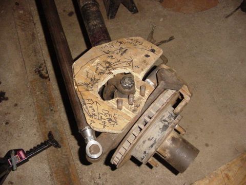 1992 Ford Bronco - A custom-fabricated part template with handwritten notes and measurements, likely for a vehicle suspension modification.