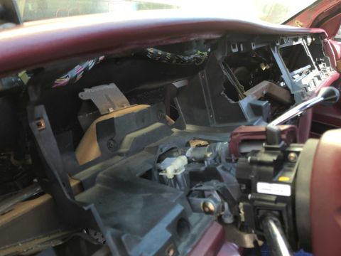 1992 Ford Crown Victoria - Interior view of a car's dashboard with components removed, revealing wiring and structure.