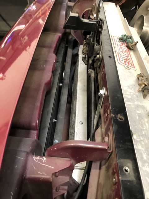 1992 Ford Crown Victoria - Close-up view of a car's engine bay, showing the radiator and surrounding components.