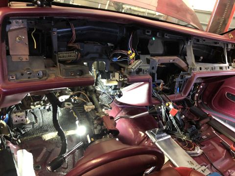 1992 Ford Crown Victoria - Interior view of a car's dashboard undergoing repairs, with many wires and components visible.