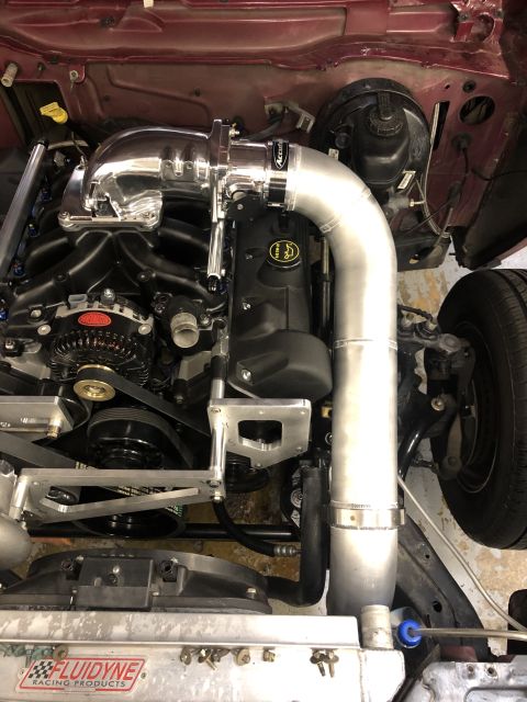 1992 Ford Crown Victoria - Close-up of a modified Ford V8 engine, custom intake and a racing radiator.