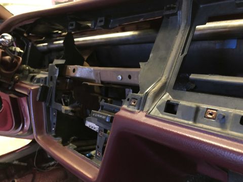 1992 Ford Crown Victoria - The interior of a vehicle is shown with the dashboard removed, revealing the underlying structure and components.