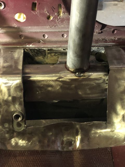 1992 Ford Crown Victoria - This image shows a section of a vehicle's body undergoing repair, with visible metalwork and a pipe protruding.