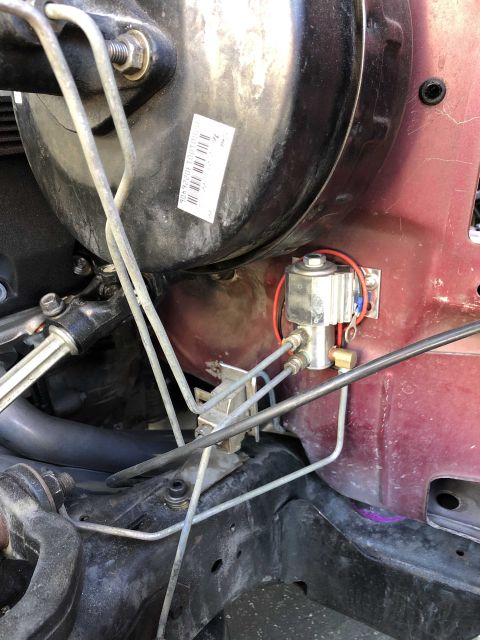 1992 Ford Crown Victoria - Brake booster and associated vacuum lines with a solenoid valve. Sticker on booster has barcode.