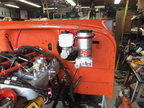 1992 Jeep Wrangler - The engine bay of a Jeep is shown, new power steering components and brake system parts.