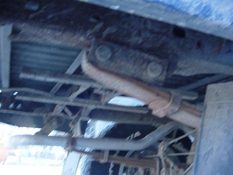 1992 Ford Bronco - Underside view of a vehicle's frame and exhaust system.