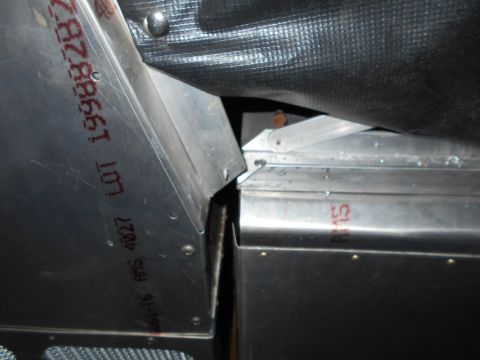 1992 Ford Bronco - Close-up of metal components showing stamped lot and part numbers, including '1998'.