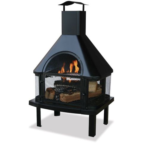 1985 Toyota Hilux - This outdoor fireplace has a black metal construction with a mesh screen and a chimney, containing burning logs.