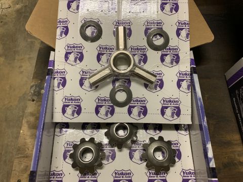 2002 Ford Excursion - Yukon Gear & Axle parts are laid out on packaging the brand's polar bear logo.
