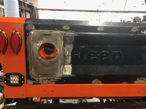 1992 Jeep Wrangler - This 1992 Jeep Wrangler tailgate shows ongoing bodywork, including repairs around the fuel filler and new LED lights.