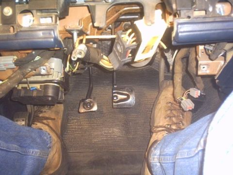 1991 Ford LTD Crown Victoria - The driver's side footwell shows pedals and exposed wiring, suggesting a work-in-progress or repair.
