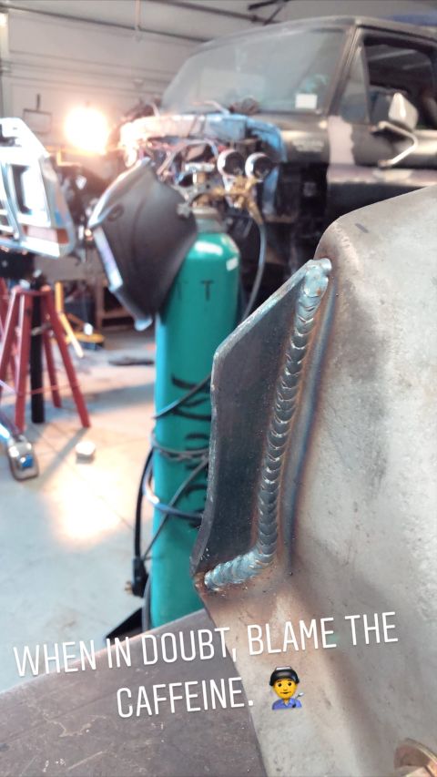 1979 Ford Bronco - Close-up of fresh welds on a vehicle's frame, with a gas cylinder and shop equipment visible.