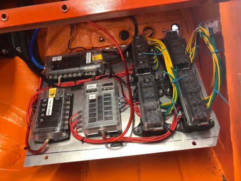1992 Jeep Wrangler - Close-up of a vehicle's electrical fuse box, showing organized wiring and multiple fuse slots.