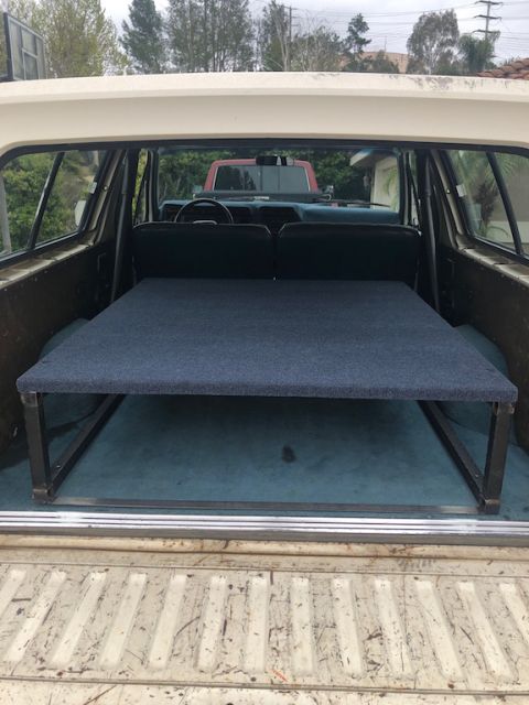 1981 Ford Bronco - This Ford Bronco has been modified with a custom bed platform, and another vehicle is seen in the background.