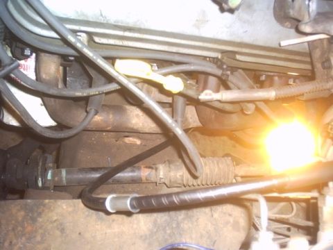 1991 Ford LTD Crown Victoria - Close-up view of the engine bay components of a 1991 Ford Crown Victoria.
