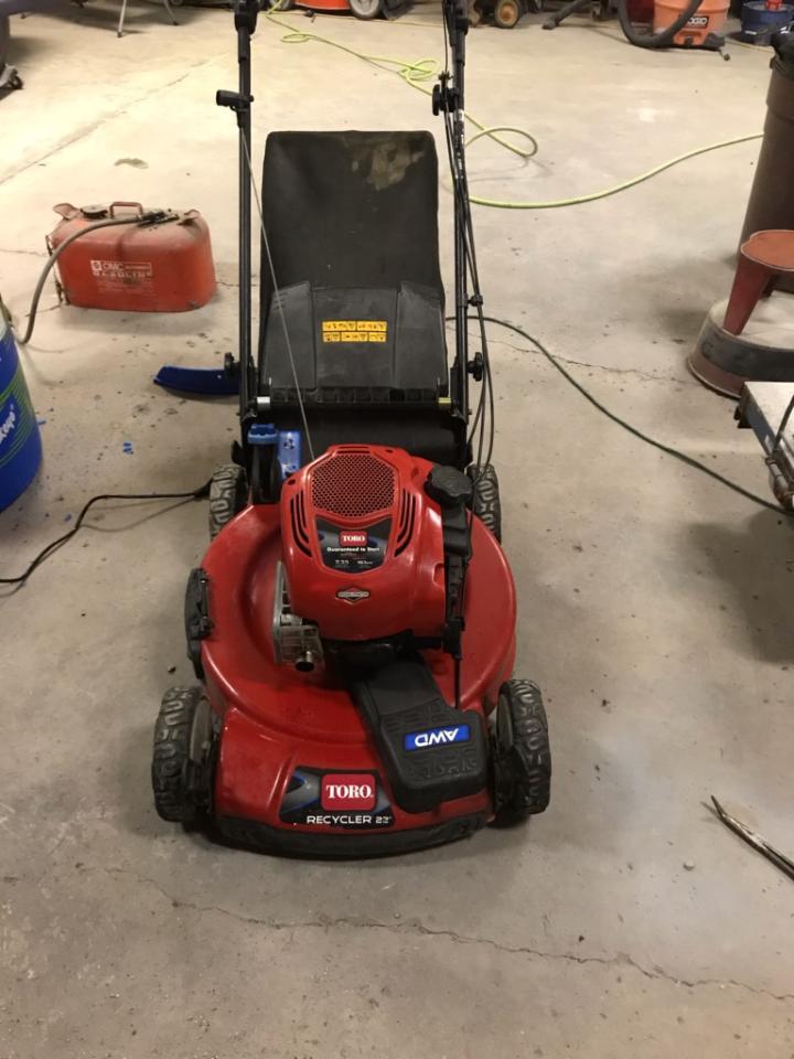 Red Toro Recycler 22 lawnmower with AWD label