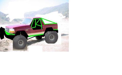 1992 Ford Bronco - This modified 1992 Ford Bronco features a custom green roll cage and large off-road tires, suggesting it's built for terrain.