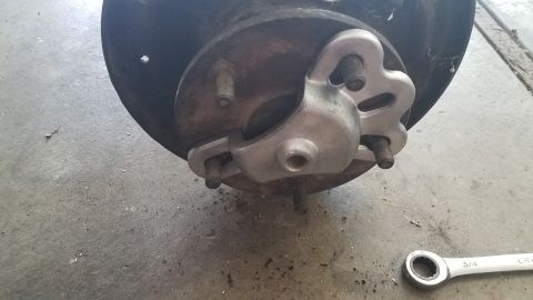 1985 Ford Bronco - This image shows a wheel hub assembly, likely from a truck or SUV, with a brake rotor and caliper bracket visible. The registry claims it i…