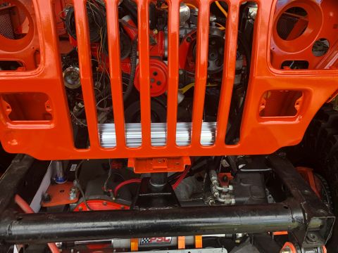 1992 Jeep Wrangler - Front view of a 1992 Jeep Wrangler's engine bay, showing the grille and engine details.