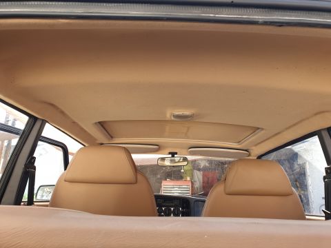 1991 Saab 900 - Interior of a 1991 Saab 900, tan upholstery and a sunroof.