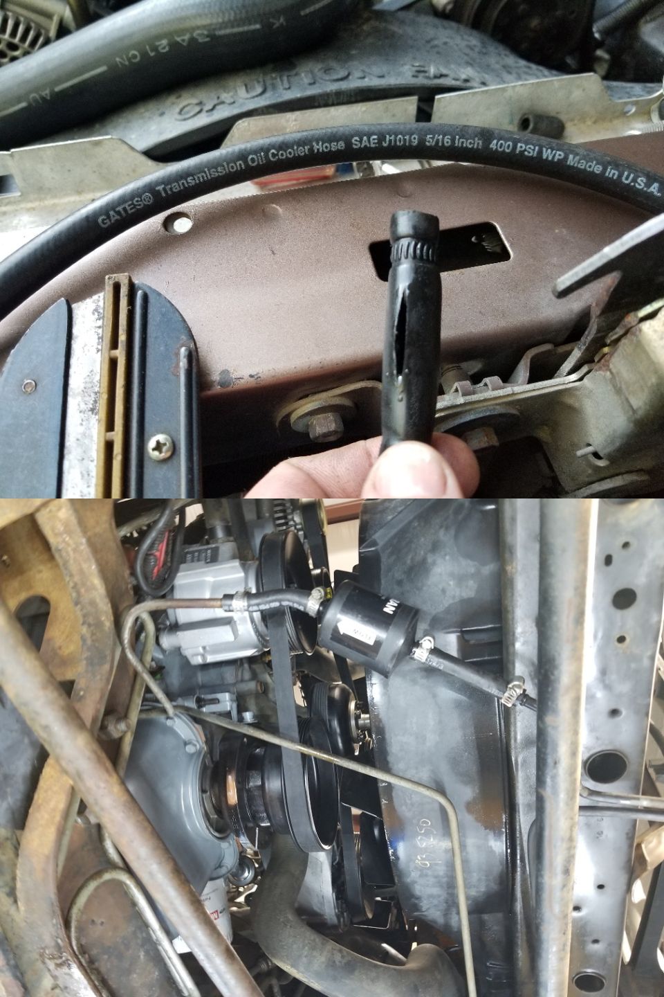 Hand holding a damaged spark plug wire boot over a vehicle engine bay with hoses and belts visible