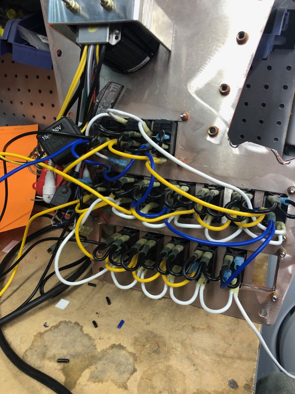 Close-up of a complex automotive wiring harness with many colored wires and connectors