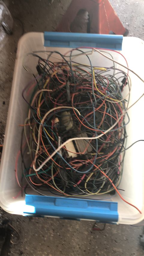 1992 Jeep Wrangler - A bin filled with a mess of electrical wires, likely from a vehicle's wiring harness.