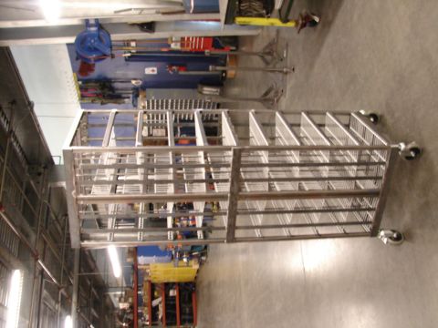 1973 Ford Ranchero - Metal shelving unit on wheels in a workshop.