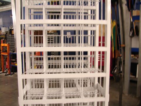 1973 Ford Ranchero - A white metal shelving unit dominates the foreground, with tools and equipment visible in the background.