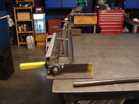 1973 Ford Ranchero - Workbench setup with a metal fabrication tool, likely for bending sheet metal.