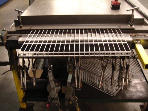 1973 Ford Ranchero - A workbench holds wire racks and various tools, with a red drill visible in the background.