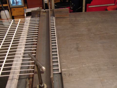 1973 Ford Ranchero - A close-up view of metal grating positioned on a workbench, with a ruler guide visible.