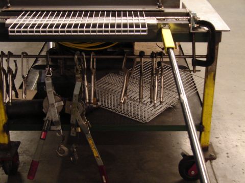 1973 Ford Ranchero - A shop cart is filled with various tools and metal baskets.