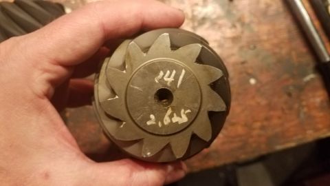 1985 Ford Bronco - A close-up shows a differential gear with handwritten numbers indicating its specifications.
