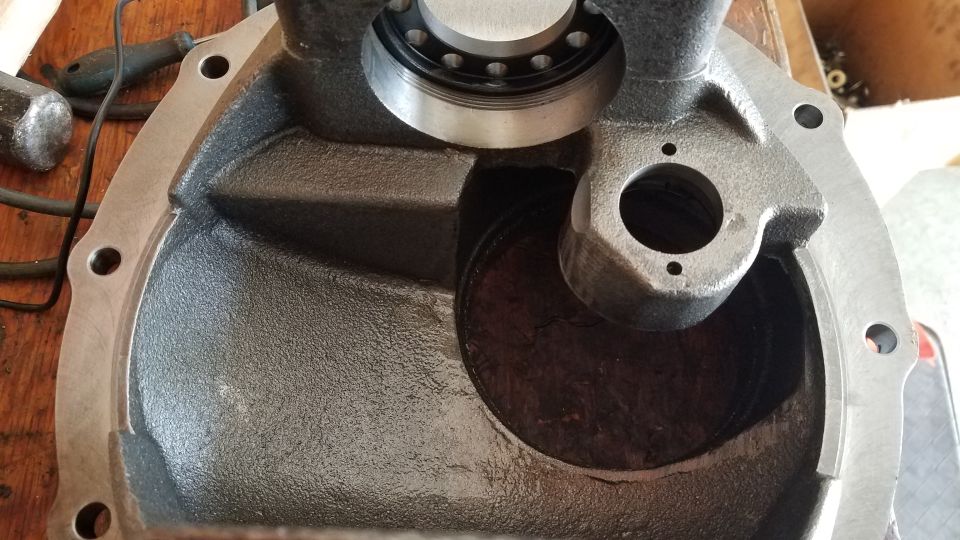 Close-up of a cast iron differential housing with a bearing.