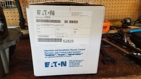 1985 Ford Bronco - A white Eaton differential box is shown in a workshop setting. The box has product information including model number 913A586 TT Ford 9" 31…