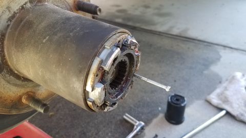 1985 Ford Bronco - A close-up view of a vehicle's differential housing, revealing internal gears.