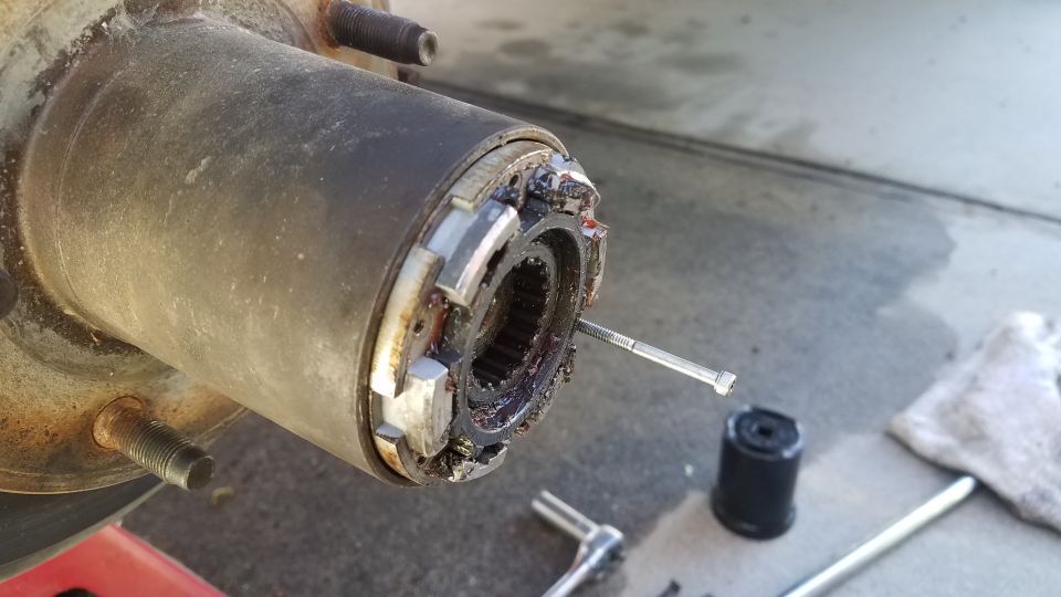 Close-up of a metal differential housing with visible gears inside