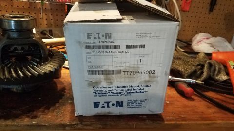 1985 Ford Bronco - A new Eaton differential is boxed and ready for installation, shown next to an open differential unit. The box displays part numbers and br…