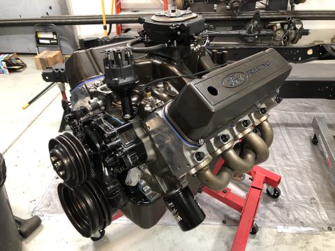 1979 Ford Bronco - Close-up view of an engine assembly, likely undergoing a rebuild or modification.