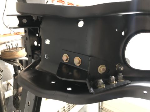 1979 Ford Bronco - Close-up view of a custom-fabricated vehicle frame bracket, likely for a modification project.